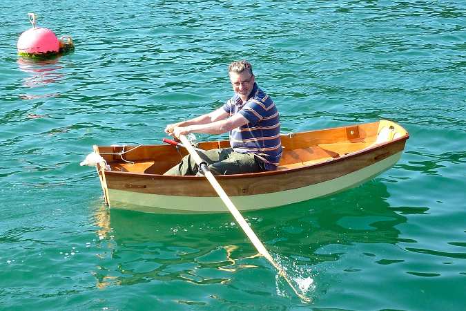 Canadian canoe - a lightweight wooden open boat that is easy to paddle