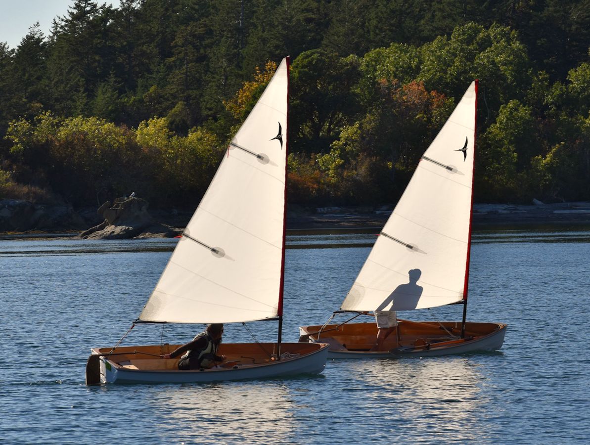 A pair of PT 11 nesting dinghies sailing